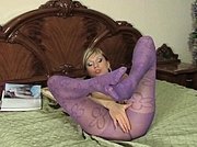 Cutie in violet patterned tights flashing her feet and fingering her pussy